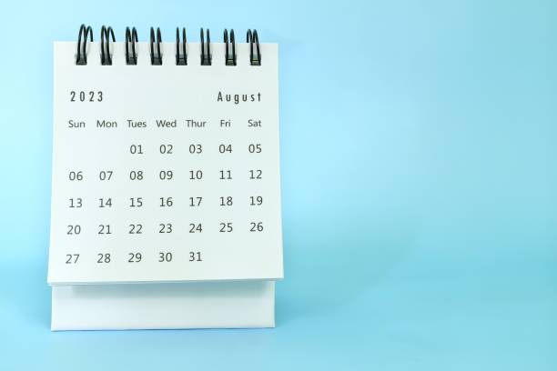 istock Selective focus of August 2023 desk calendar on blue background with copy space. 1499337814