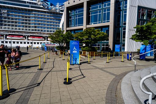 Seattle, Washington USA - June 3, 2023 : Early morning frenzied activity at Pier 66 as people prepare to board a ship for their Alaskan Cruise.