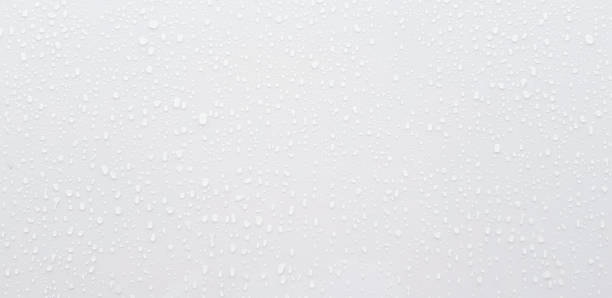 istock Raining water drops on gray or white stainless steel wall for background. 1499350133