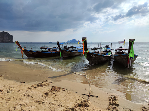 Long tail boats moored at the famous Ao Nang beach, a resort town in Krabi province.
