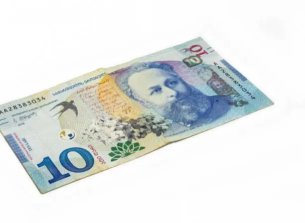 Photo of Ten  Lari banknote of the National Bank of Georgia on a white background