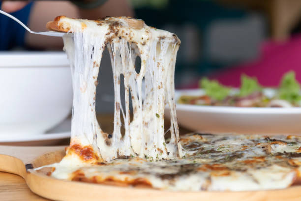 istock Pizza black truffle with cheese melting on wooden pizza plate. 1499362046