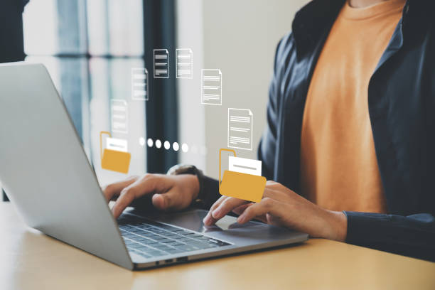 istock Businessman working with file transfer on laptop. 1499363598