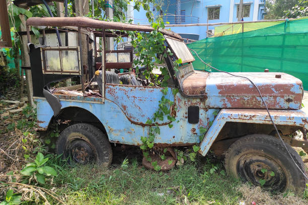 istock A rustic vintage abandoned car is left in a neglected condition in the garden 1499367458