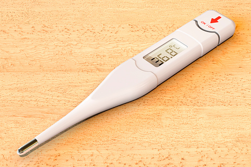 Digital electronic thermometer, on the wooden table. 3D rendering