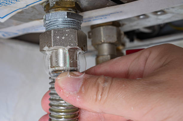 gas leak at home boiler room. inflating bubbles of soap mixture applied to the threaded joint on the gas flexible pipe indicate a gas leak. - gas natural gas leaking sensor imagens e fotografias de stock