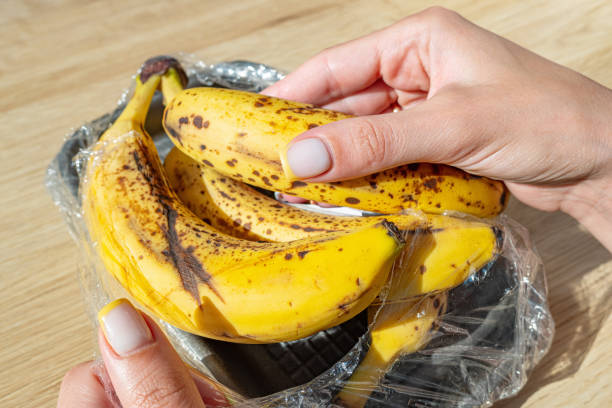 istock Woman holds a rotten bananas. 1499369832