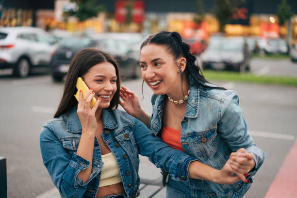 istock Two girlfriends sitting in park. 1499370776
