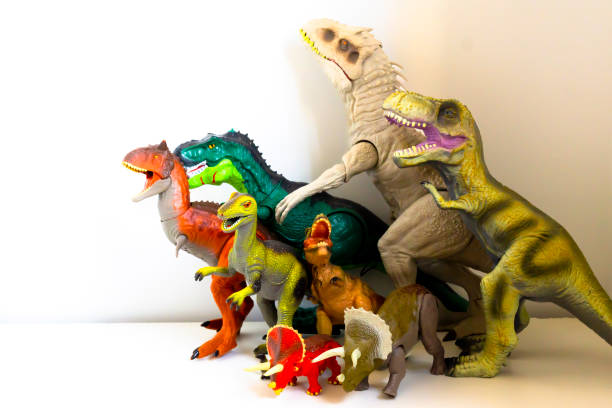 istock Group of toy dinosaurs isolated on white background 1499372531