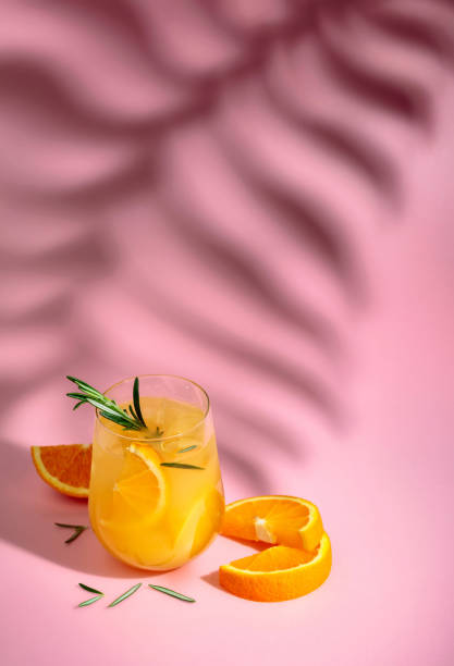 istock Summer cocktail with orange, rosemary, and ice. 1499372673