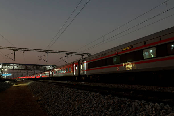 istock Express train at night on railroad track 1499373016