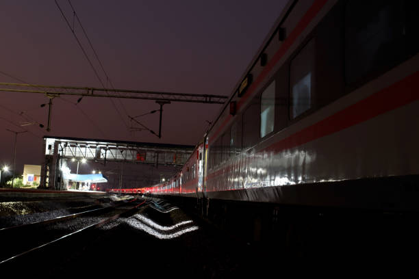 istock Express train at night on railroad track 1499373018