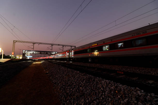 istock Express train at night on railroad track 1499373019