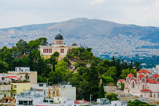 A photo depicting the Acropolis and some of the surrounding city of Athens.  