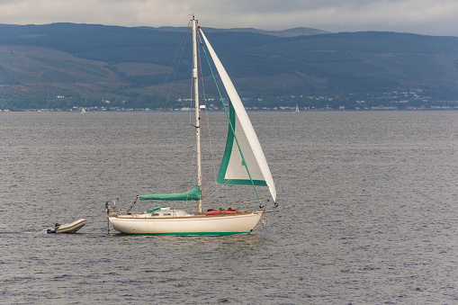 boat at coast of millport town at famous touristic cumbrae island at near largs glasgow scotland england UK