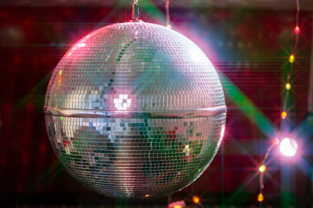 istock Disco ball with bright beams, night party background photo. 1499382910