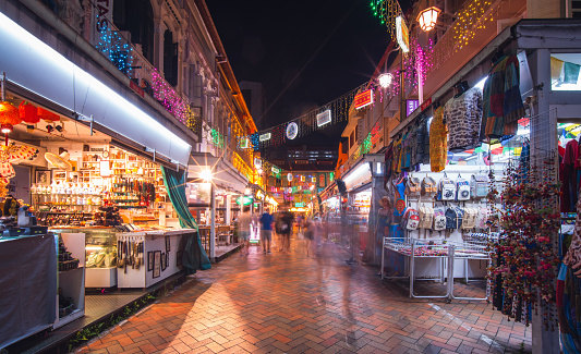 View of street market stalls at night in Chinatown, Singapore.