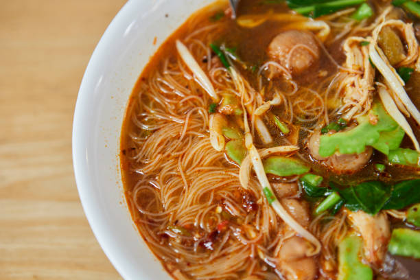Rice vermicelli noodles with braised chicken meat  in a bowl