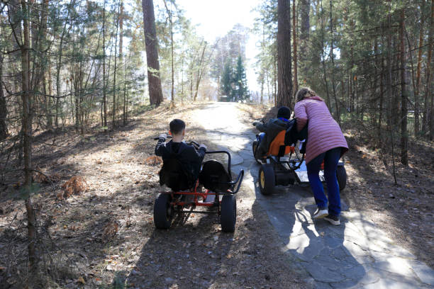 istock Brothers riding tricycles in park 1499386916