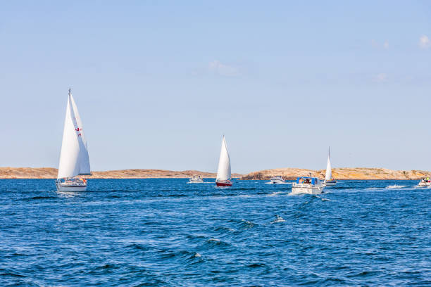 Sailboat on sea and rocky coastline, Lysekil, Västra Götaland County, Gullmarn fjord
