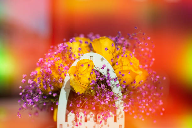 istock Bouquet of artificial flowers in orange-yellow gradient. 1499389718