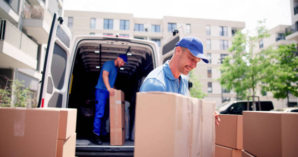 House Mover Walking Near Delivery Van stock photo