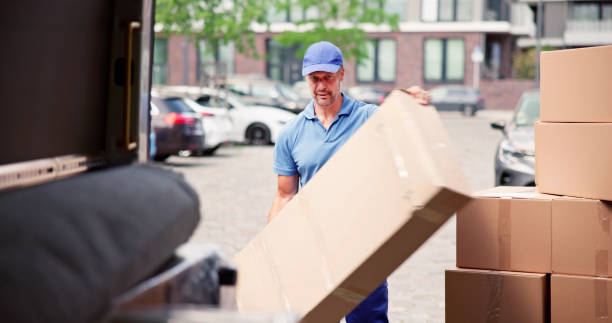 Male Movers In Uniform Loading Delivery stock photo