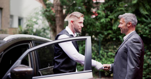 istock Man Giving Car Key To Male Valet 1499392934