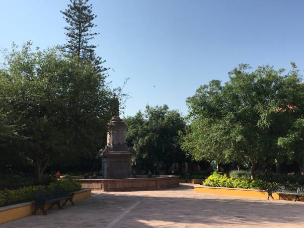 istock A park with trees and a statue, in Queretaro, in Mexico 1499394194