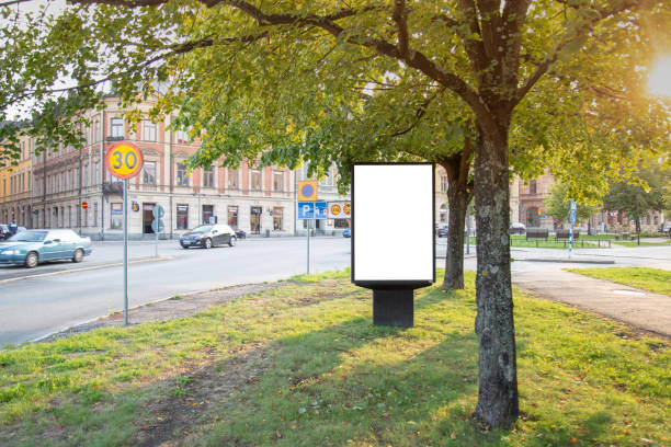 istock Blank billboard mock up on city road for text message or content. 1499396187