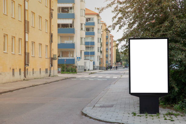 istock Blank billboard mock up on city road for text message or content. 1499396238