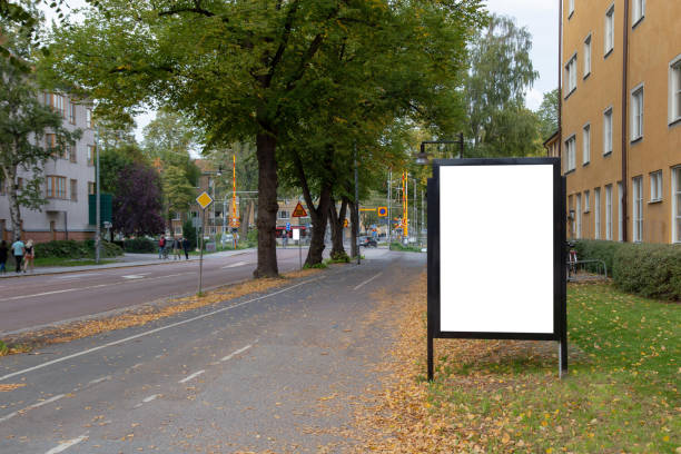 istock Blank billboard mock up on city road for text message or content. 1499396241