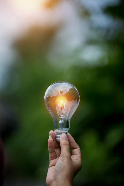 istock light bulb against nature, icons 1499396473