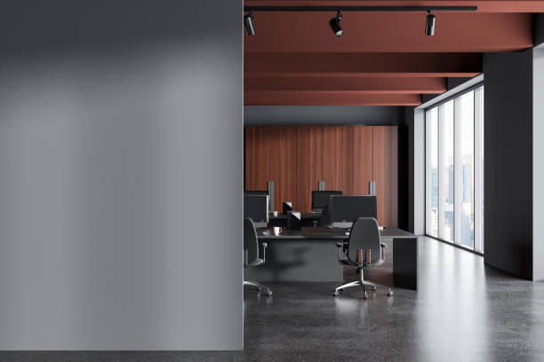 istock Gray and brown ceiling open space office with wardrobe and mock up wall 1499402456