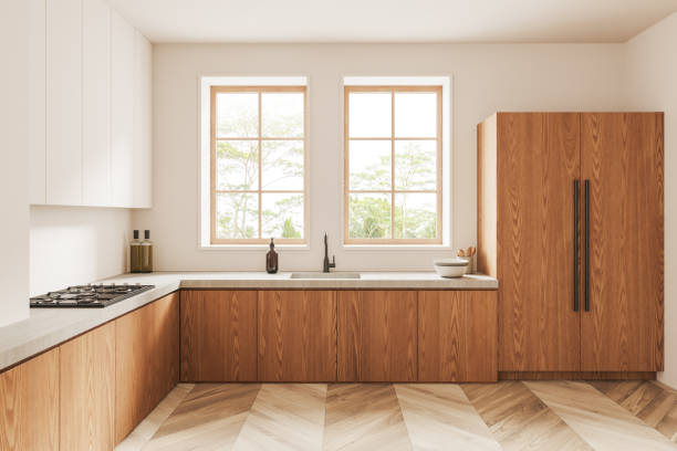 istock Modern white kitchen interior with white and wooden cabinets 1499404737