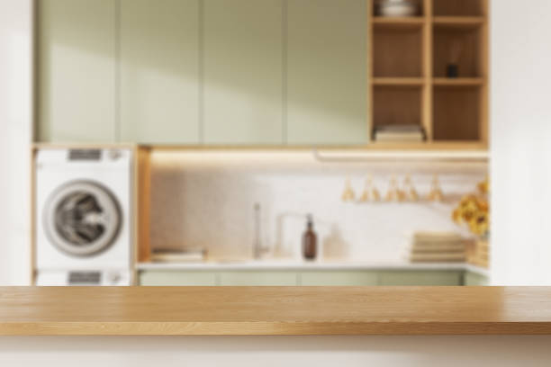 istock Table in blurry white and green laundry room 1499405042
