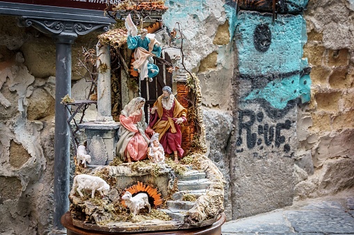 Naple, Italy – December 07, 2022: A sculpture of the Nativity scene featuring various figures in San Gregorio Armeno