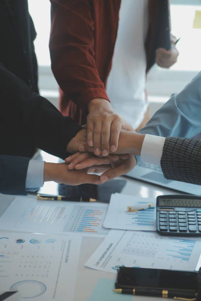 istock Success Teamwork Concept, Business people joining hands city background. 1499414382