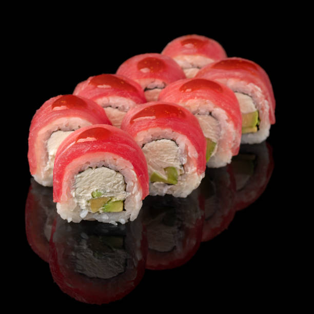 istock Traditional delicious fresh sushi roll set on a black background with reflection. Sushi menu. Japanese kitchen, restaurant 1499415764