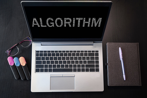 Laptop with algorithm text. Top view. Algorithm inscription on laptop screen.
