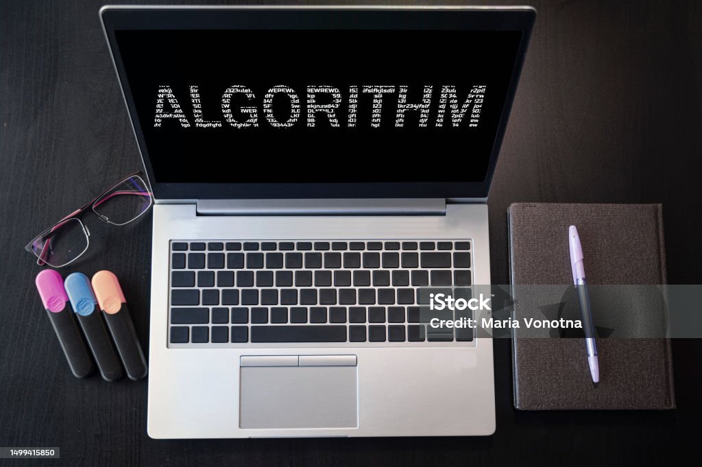 Laptop with algorithm text. Top view. Algorithm inscription on laptop screen. Above Stock Photo