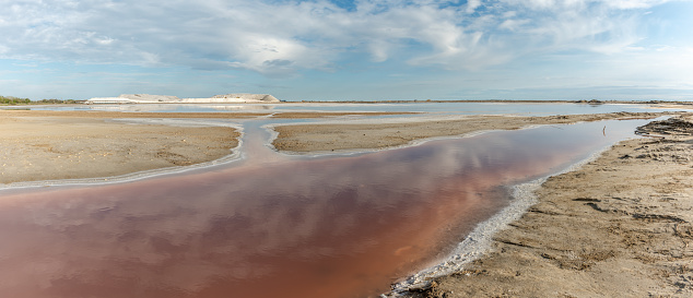 Salt exploitation in the village of Salin de Giraud near the mouth of the Grand Rhone. Panorama, panoramic. Parc naturel regional, Arles, Bouches du Rhone, Provence Alpes Cote d'Azur, France.
