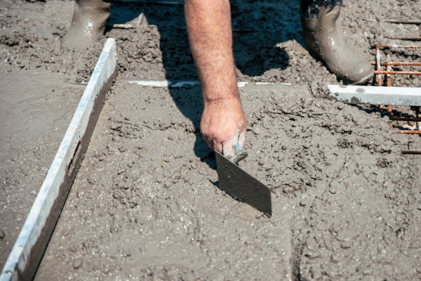 istock Working with steel trowel and smoothing plaster on freshly poured concrete 1499417058