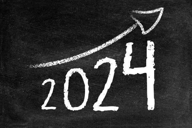 istock 2024 with ascending arrow on blackboard 1499418781