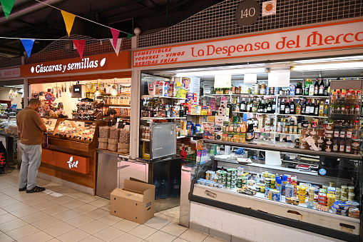 Alicante, Spain, june 7, 2023 : Shops and customer in the central market of Alicante