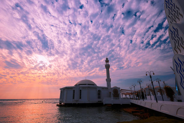 Al Rahma Floating Mosque - Sea Mosque Our tour guide took us to the Sea Mosque, that is what he said, I think. It is known for the Floating Mosque in Jeddah and one of the sightseeing spots next to the ocean. Because of the tide, the mosque looks like it is floating over the red sea. It was right before the sunset and the color of the sky was changing to sunset mood. jeddah stock pictures, royalty-free photos & images