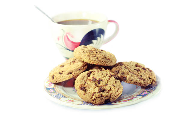 istock black coffee and cookies stack in dish isolated on white background 1499426983
