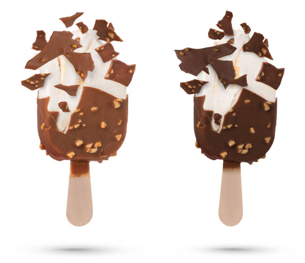 istock Chocolate ice cream isolate on a stick flying pieces of chocolate icing. Chocolate ice cream on a white isolated background with scattered pieces of chocolate and vanilla inside. 1499431910