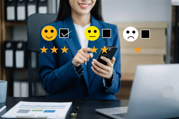 istock Woman holding a digital tablet and smartphone with checkboxes rating smiley faces excellent for Satisfaction Survey, Happy Client Customer Experience concept. 1499433457