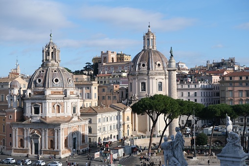 A view of Santa Maria di Loreto and Santissimo Nome di Maria church and Trajan Column in Rome, Italy